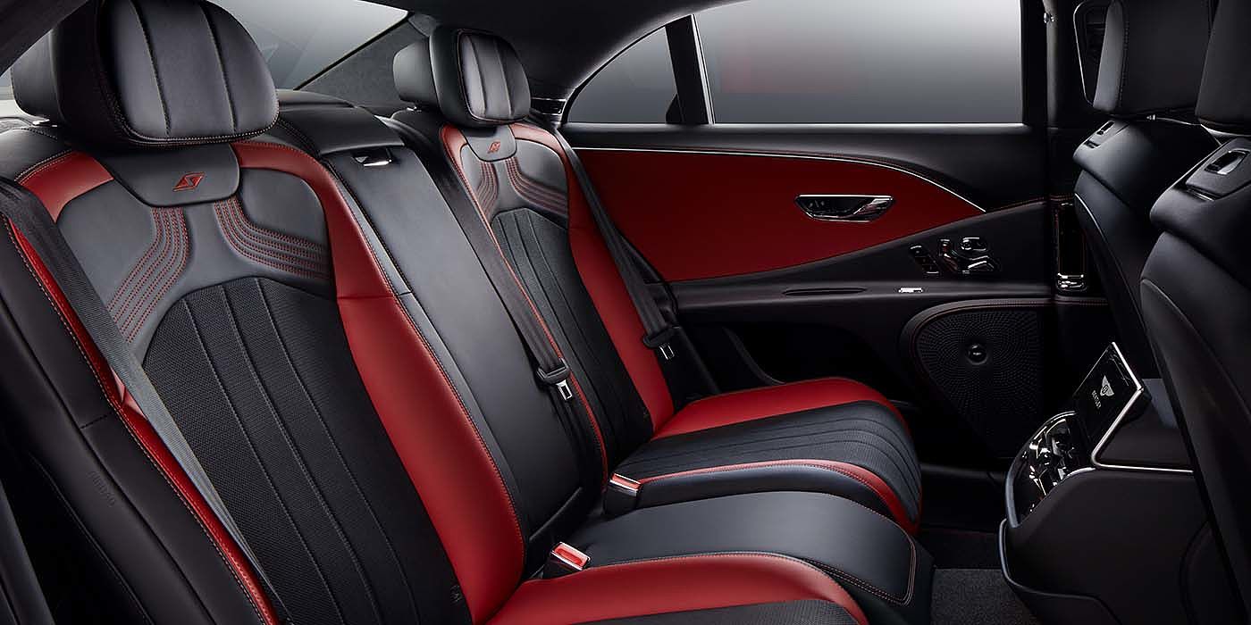 Bentley Singapore Bentley Flying Spur S sedan rear interior in Beluga black and Hotspur red hide with S stitching