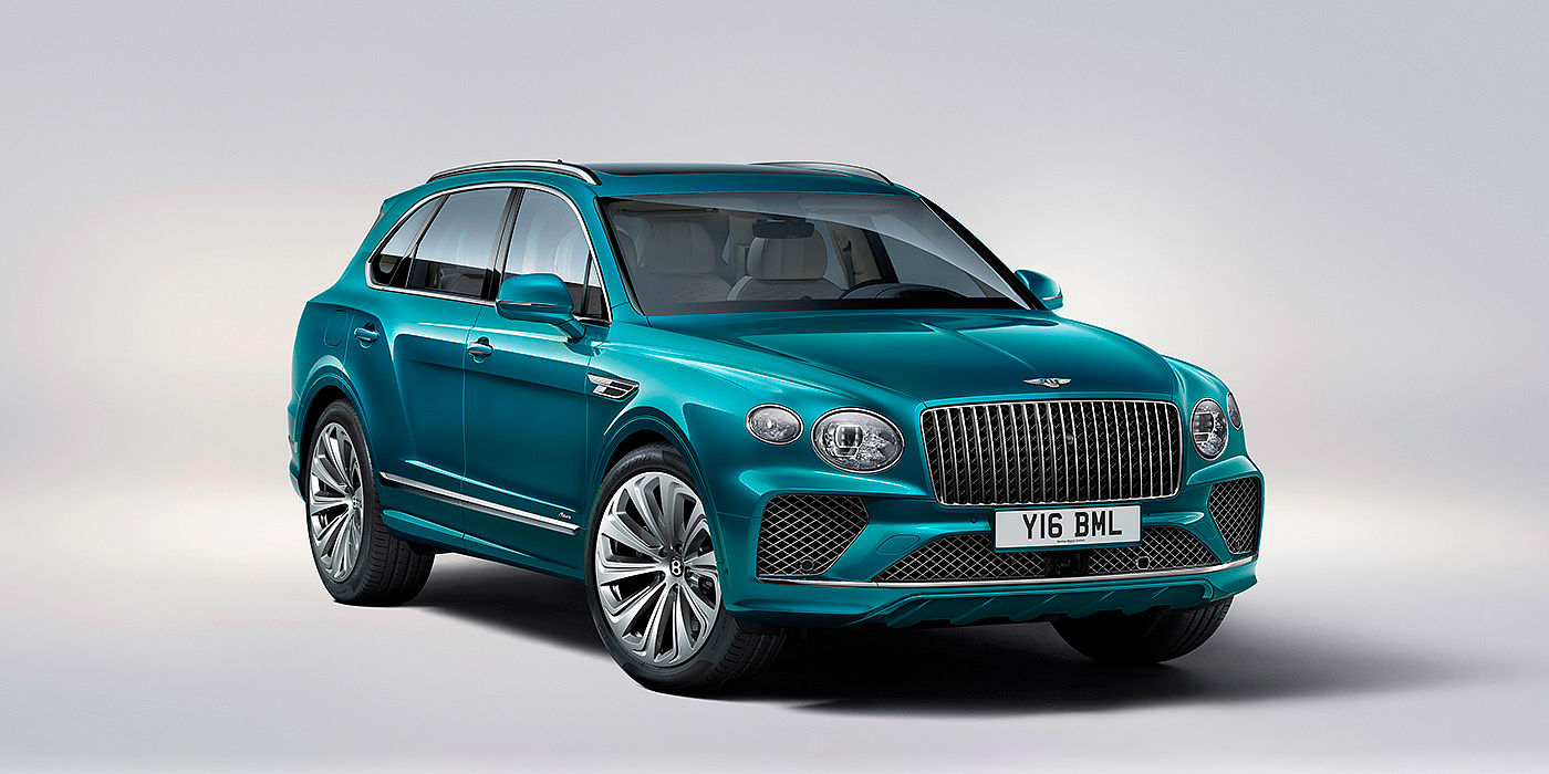 Bentley Singapore Bentley Bentayga Azure front three-quarter view, featuring a fluted chrome grille with a matrix lower grille and chrome accents in Topaz blue paint.