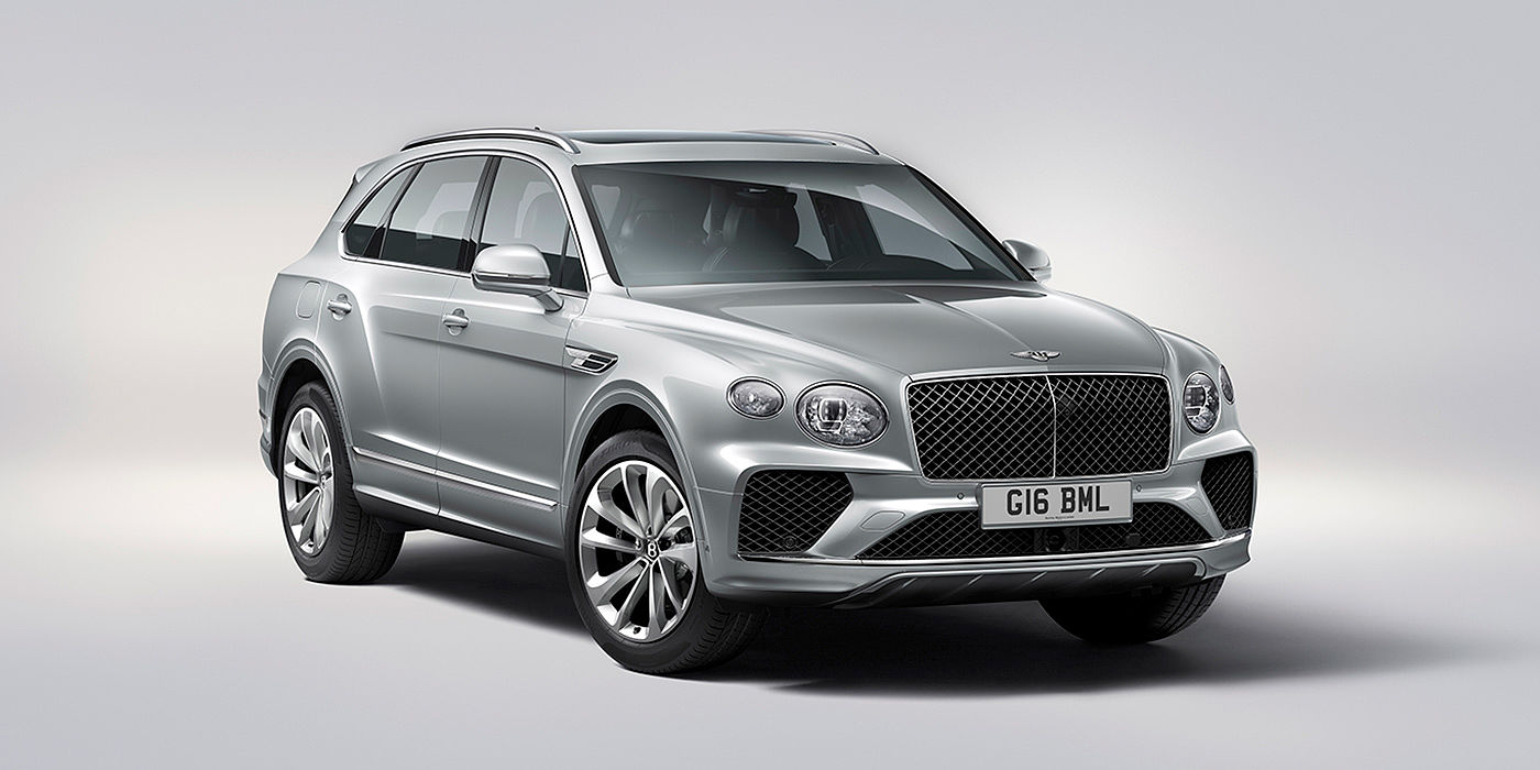 Bentley Singapore Bentley Bentayga in Moonbeam paint, front three-quarter view, featuring a matrix grille and elliptical LED headlights.