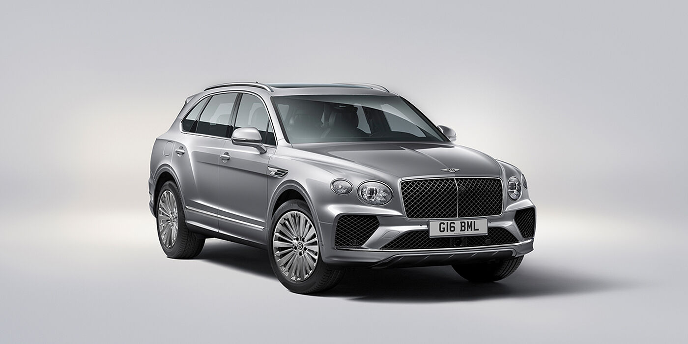 Bentley Singapore Bentley Bentayga luxury SUV front three quarter view in Moonbeam paint with matrix grille and 21″ 5 spoke painted wheels