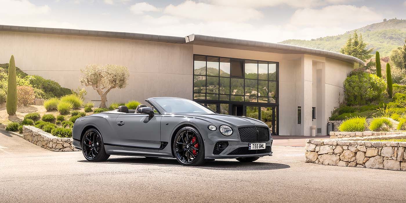 Bentley Singapore Bentley Continental GTC S convertible in Cambrian Grey paint front 34 static near house