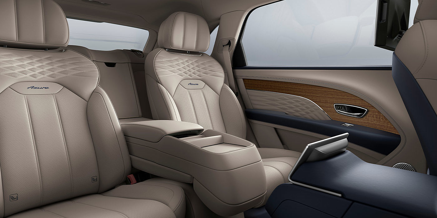 Bentley Singapore Bentley Bentayga EWB Azure interior view for rear passengers with Portland hide featuring Azure Emblem in Imperial Blue contrast stitch.