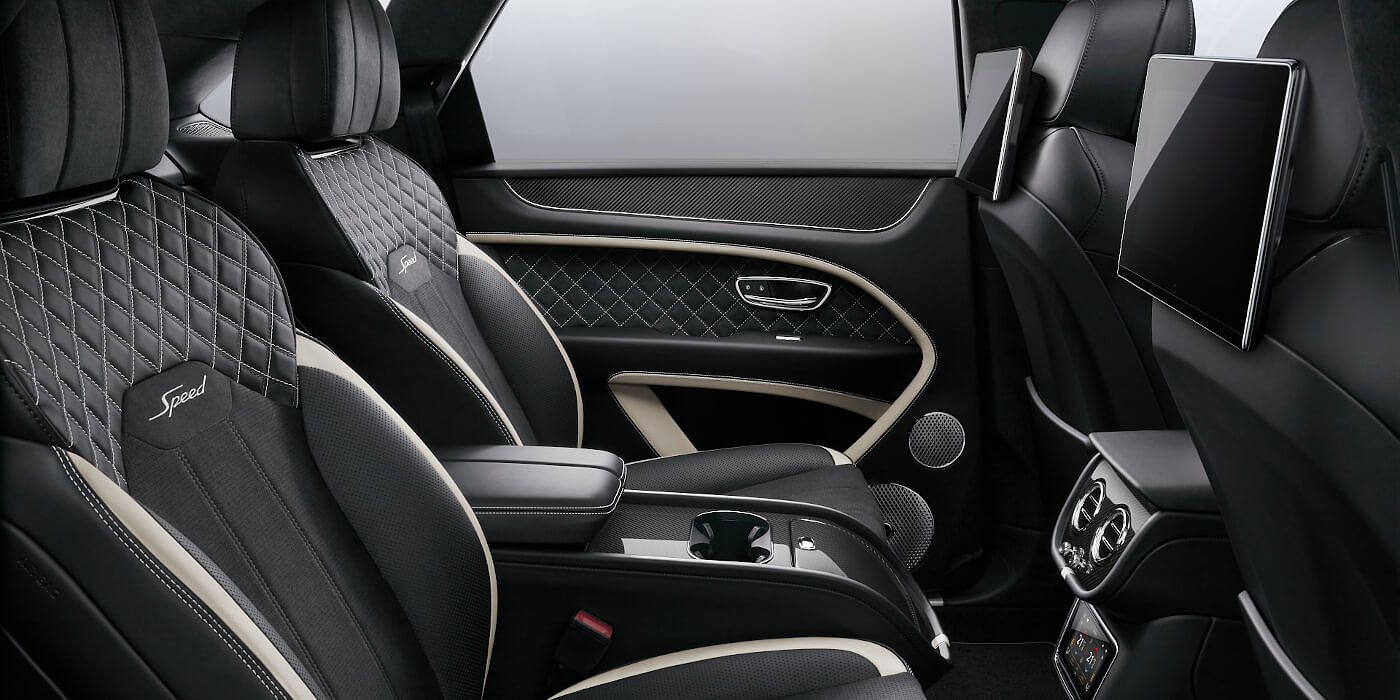 Bentley Singapore Bentley Bentayga Speed SUV rear interior in Beluga black and Linen hide with carbon fibre veneer