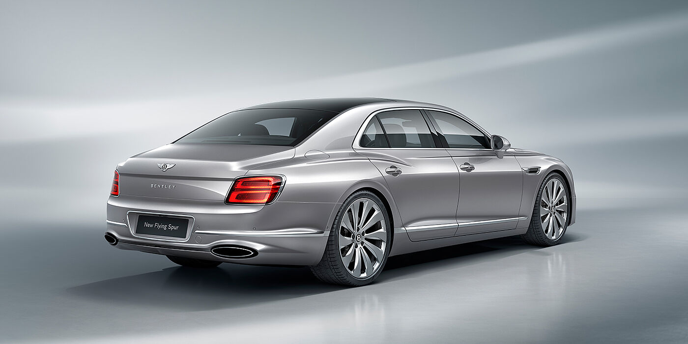 Bentley Singapore New Bentley Flying Spur sedan rear view in Silverlake paint with ten spoke wheels and chrome matrix grille