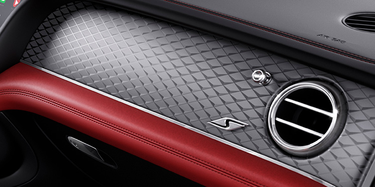 Bentley Singapore Bentley Bentayga S SUV front interior dash with Dark Tint Diamond Brushed Aluminium veneer and S badge surrounded by Hotspur red and Beluga black hide