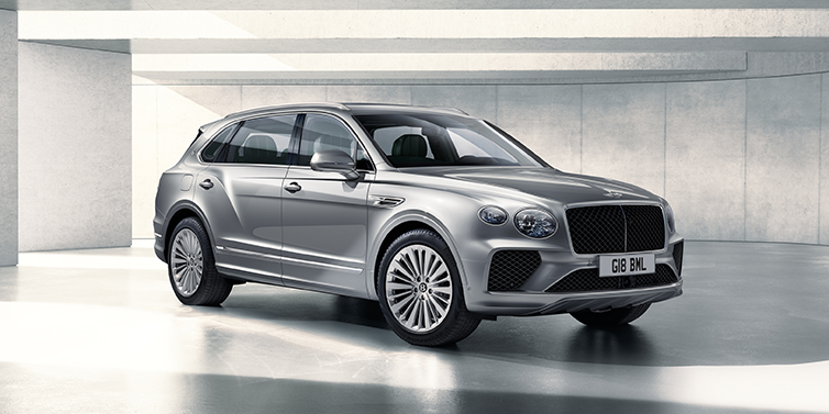 Bentley Singapore Bentley Bentayga Extended Wheelbase SUV front three quarter in Moonbeam paint with a grey background