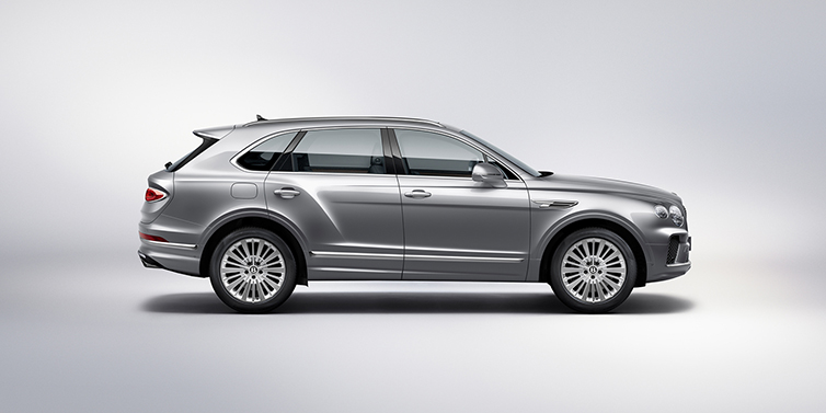 Bentley Singapore Bentley Bentayga SUV side profile in Moonbeam silver paint against white background featuring 21 inch 5 spoke wheels