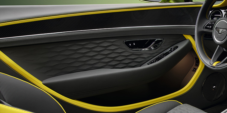 Bentley Singapore Bentley Continental GTC Speed convertible interior door details featuring Gravity Grey and Cyber Yellow by Mulliner hides and high gloss carbon fibre veneer