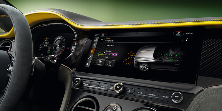 Bentley Singapore Bentley Continental GTC Speed convertible front interior centre console with MMI screen showing Air Quality visualisation surrounded by Cyber Yellow by Mulliner and Gravity Grey hides and high gloss carbon fibre veneer