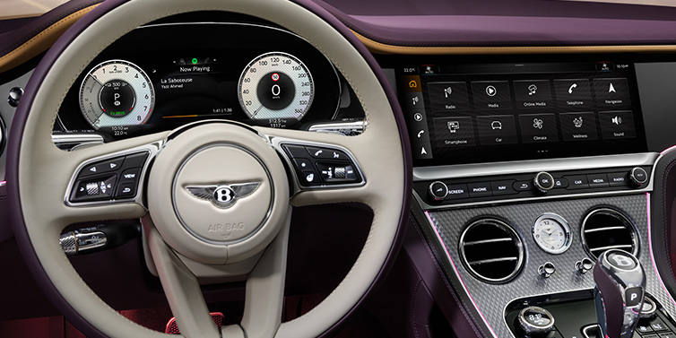 Bentley Singapore Bentley Continental GTC Mulliner convertible steering wheel and drivers screens surrounded by Damson purple and Linen hides